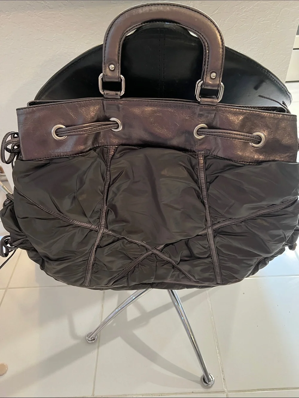 DONALD PLINER XL Black quilted nylon trimmed with Bronze Metallic  leather.